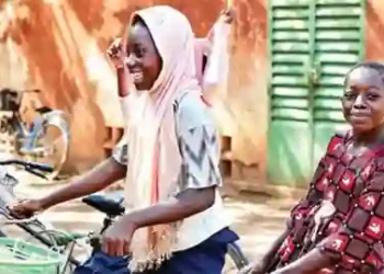 Children-ride-a-bike-in-Fada