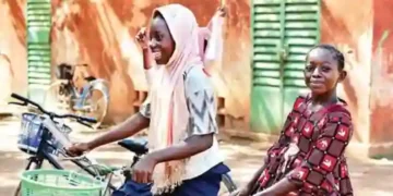 Children-ride-a-bike-in-Fada