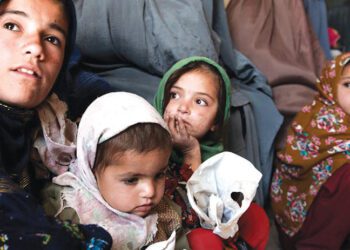 Women and children in the waiting room of a health clinic in Kandahar
