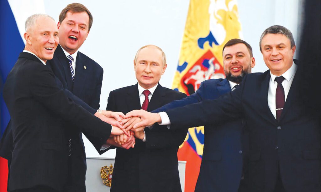 From left, Moscow-appointed head of Kherson region Vladimir Saldo; Moscowappointed head of Zaporizhzhia region Yevgeny Balitsky; Russian President Vladimir Putin; Denis Pushilin, leader of the self-proclaimed Donetsk People's Republic; and Leonid Pasechnik, leader of self-proclaimed Luhansk People's Republic pose for a photo during a ceremony at the Kremlin in Moscow.