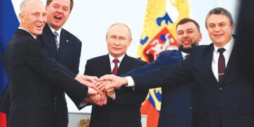 From left, Moscow-appointed head of Kherson region Vladimir Saldo; Moscowappointed head of Zaporizhzhia region Yevgeny Balitsky; Russian President Vladimir Putin; Denis Pushilin, leader of the self-proclaimed Donetsk People's Republic; and Leonid Pasechnik, leader of self-proclaimed Luhansk People's Republic pose for a photo during a ceremony at the Kremlin in Moscow.