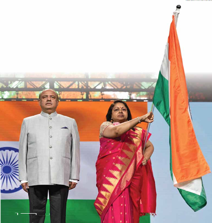 Rotary President Shekhar Mehta with Rotary First Lady Rashi Mehta, holding the national flag at the Houston Conference.