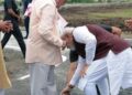 Helping lift the walking stick of a BJP karyakarta in Madhya Pradesh