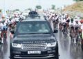 The PM convoy passes amid cyclists during a roadshow in Bikaner