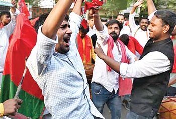 Samajwadi Party workers celebrating in Lucknow