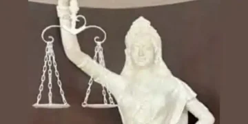 The blindfold of the goddess of justice has been removed, the constitution is now in hand