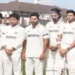 Players wear black armbands, observe a minute's silence