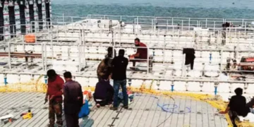Floating public bathing pool being built on the Saryu River