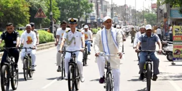 Gujarat Governor cycles to Gurukul after train journey