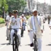 Gujarat Governor cycles to Gurukul after train journey