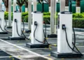 An electric car charging at a public charging point in India