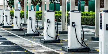 An electric car charging at a public charging point in India