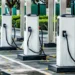 An electric car charging at a public charging point in India